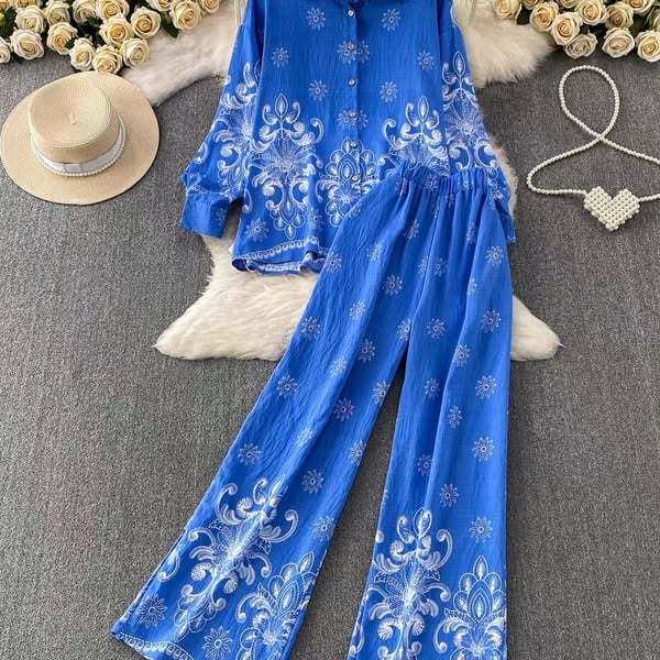 DAMI public catalog cover showing a blue printed two-piece outfit